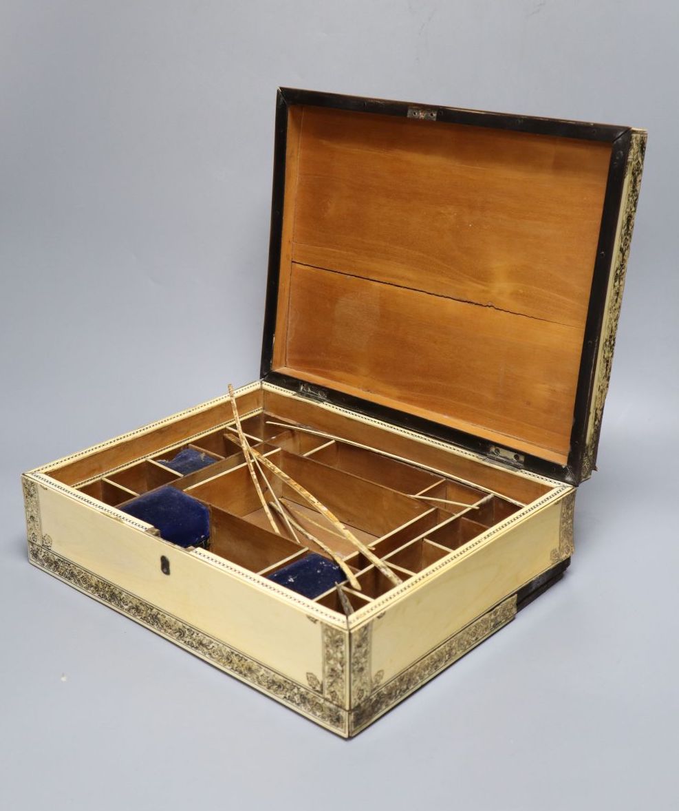 A Vizagapatam ivory sewing box, early 19th century, with interior fittings, 31cm wide